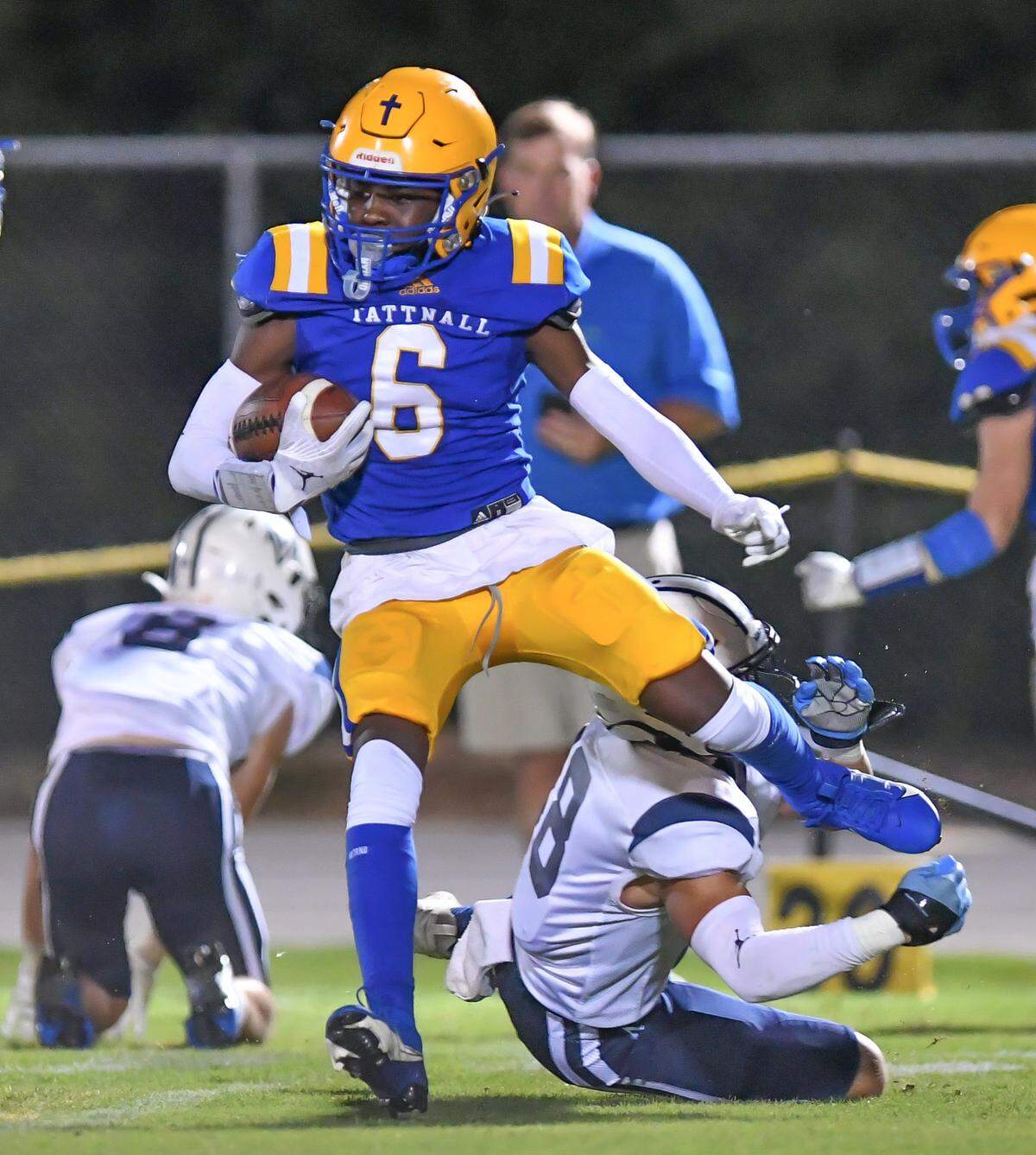 Tattnall Trojan Noah Williams (6) slips a tackle in action against Mount Vernon Friday night.
