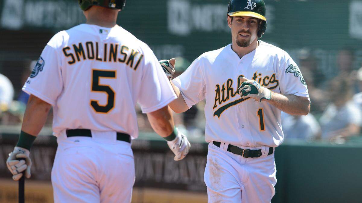 Oakland's Billy Burns (1), a Mercer product, is expected to be the A's starting center fielder when the season starts next week.