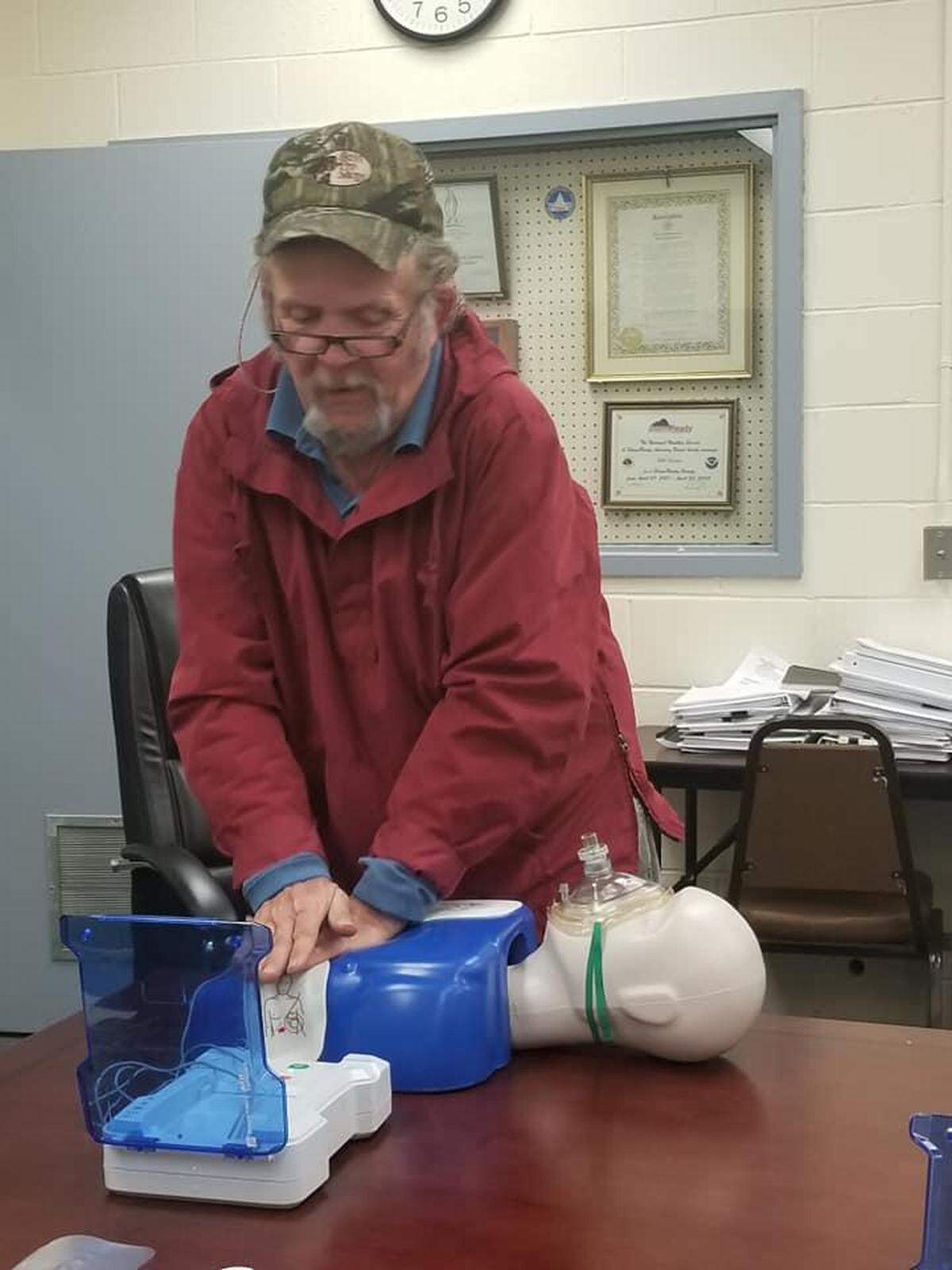 Steve Landers performs CPR on a training manikin. Landers has served as a volunteer for the Macon-Bibb County Emergency Management Agency for 50 years.