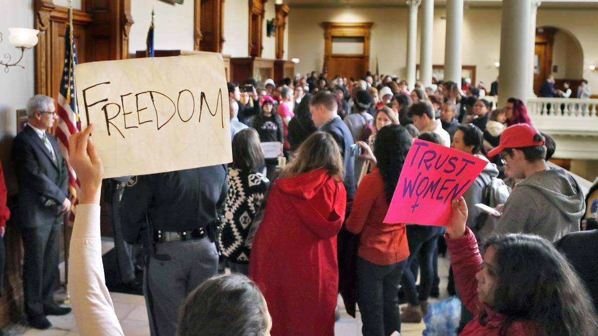 Protesters opposed to a proposed abortion bill fill the hallway in the Capitol on March 18 in Atlanta.