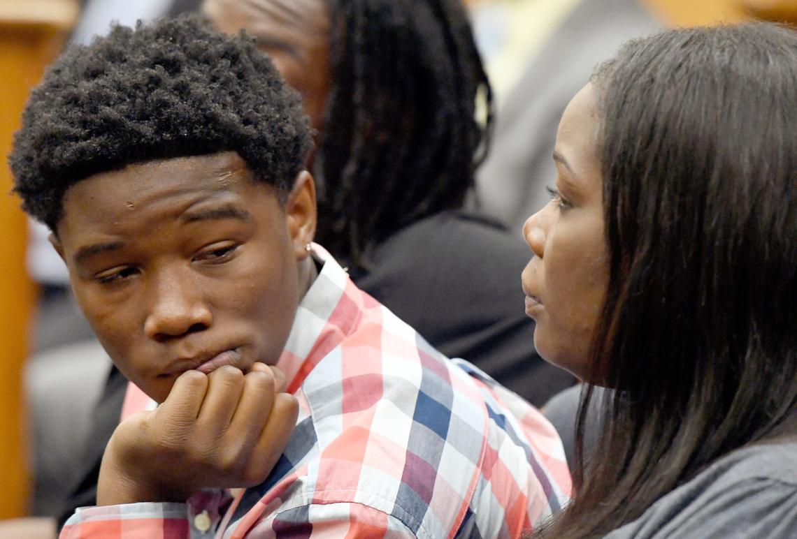 Vernon Marcus Jr. looks over at his mother Bridgite during the sentencing hearing for Elisabeth Faye Cannon Wednesday afternoon in Bibb County Superior Court. Cannon was sentenced to 20 years with five on probation for her guilty plea for aggravated assault after shooting Marcus in the head Jan. 6, 2017.