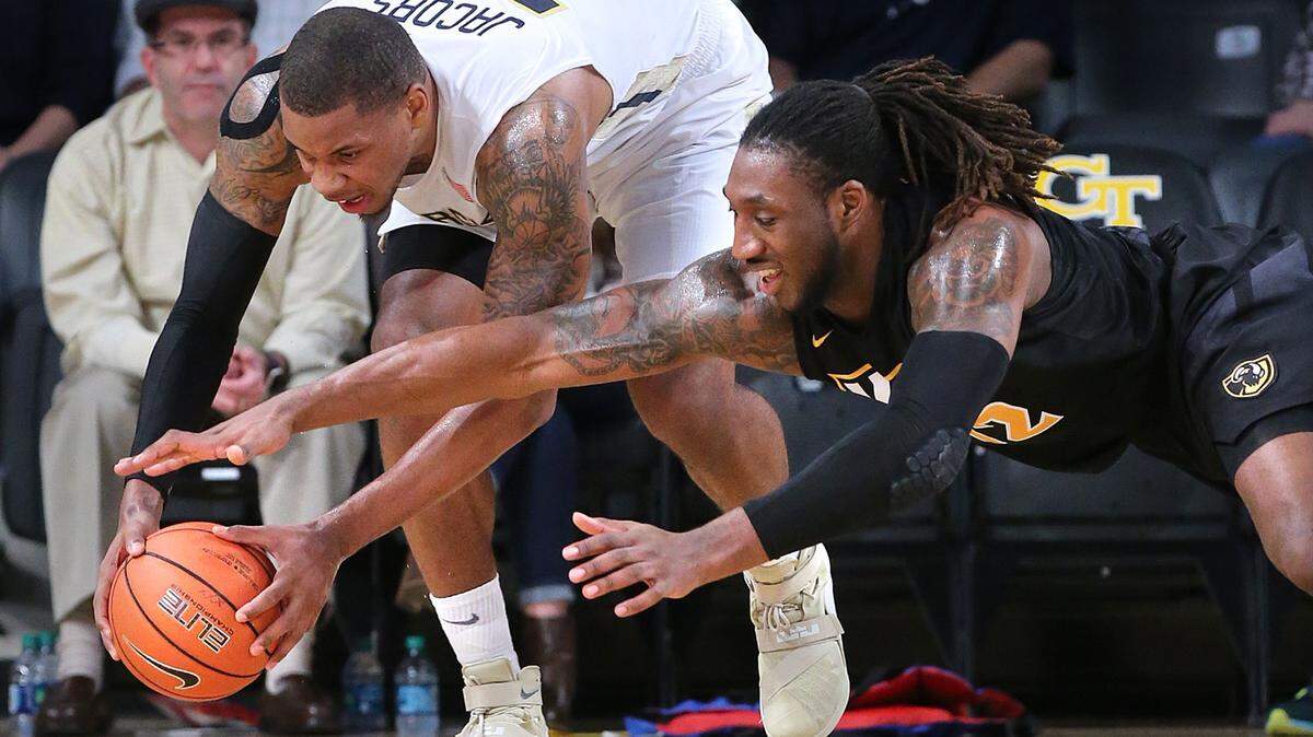 Georgia Tech forward Nick Jacobs gets the steal and draws the foul from Virginia Commonwealth forward Mo Alie-Cox during the first half of an NCAA college basketball game Tuesday, Dec. 15, 2015, in Atlanta. (Curtis Compton/Atlanta Journal Constitution via AP)