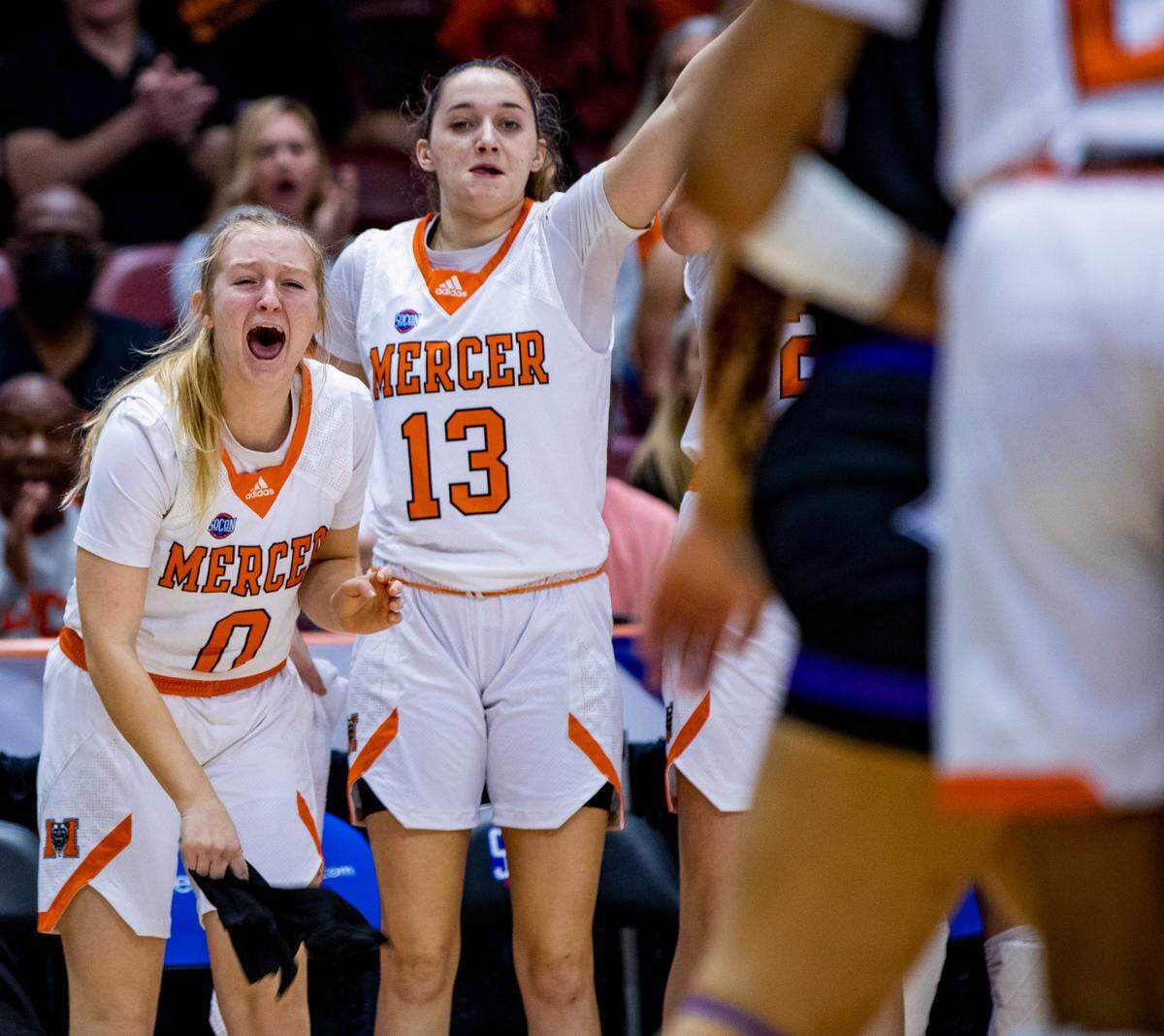 The Mercer baench cheers as the Bears face Furman Saturday afternoon in the SoCon Ingles Basketball Championships at the Harrah’s Cherokee Center in Asheville, N.C.