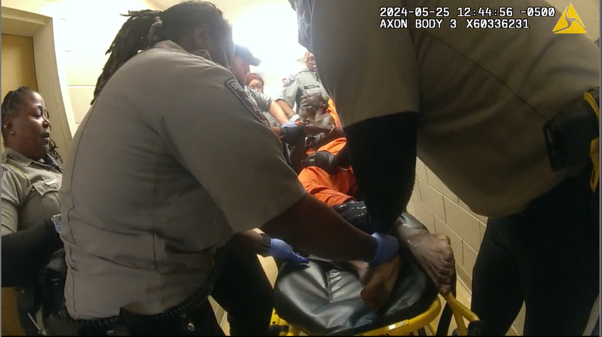 Stephen Fossett, a former inmate at the Bibb County Jail booked on trespassing charges, being put on a gurney and strapped in place on May 25, 2024. He died some minutes after a struggle with deputies.