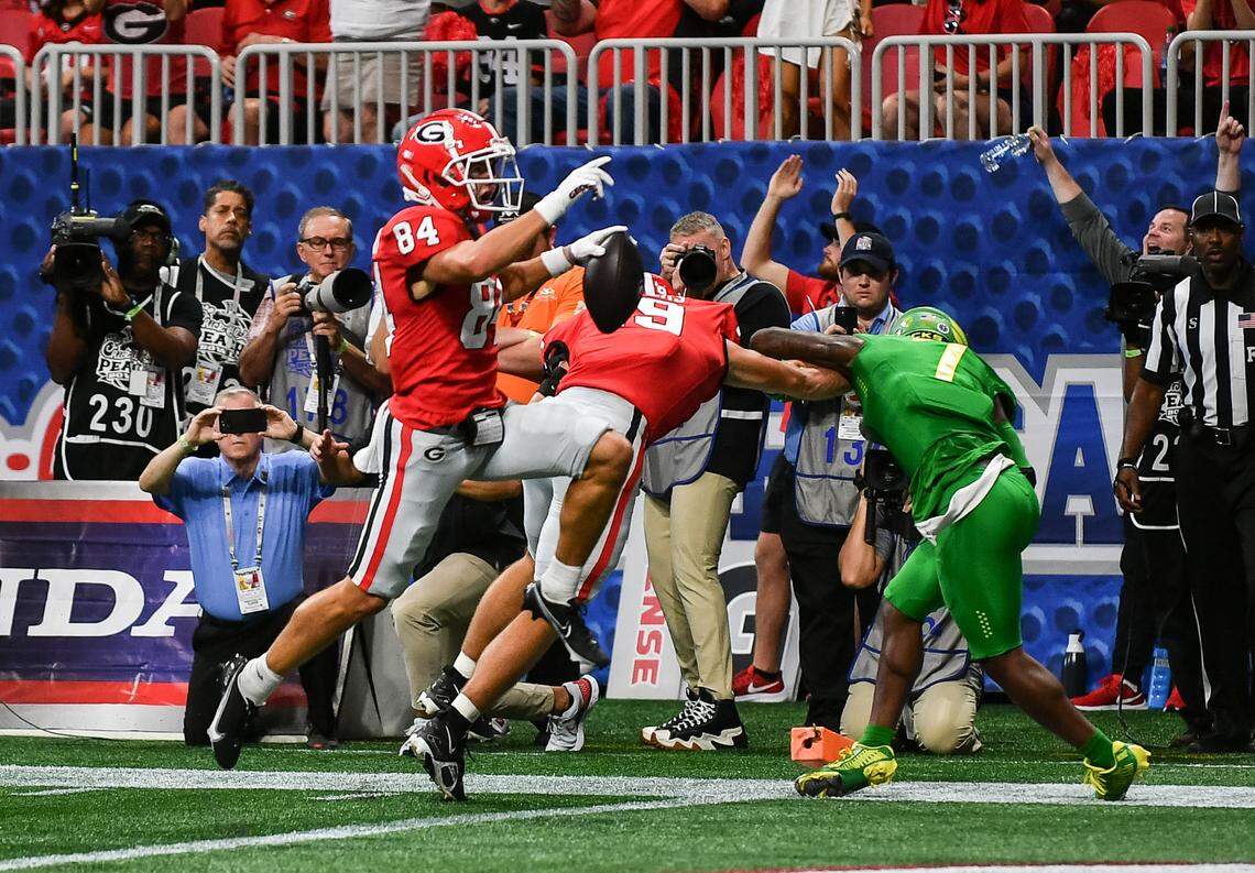 Georgia receiver Ladd McConkey (84) hops into the end zone for a touchdown during the Bulldogs’ 49-3 win over Oregon Saturday in Atlanta.