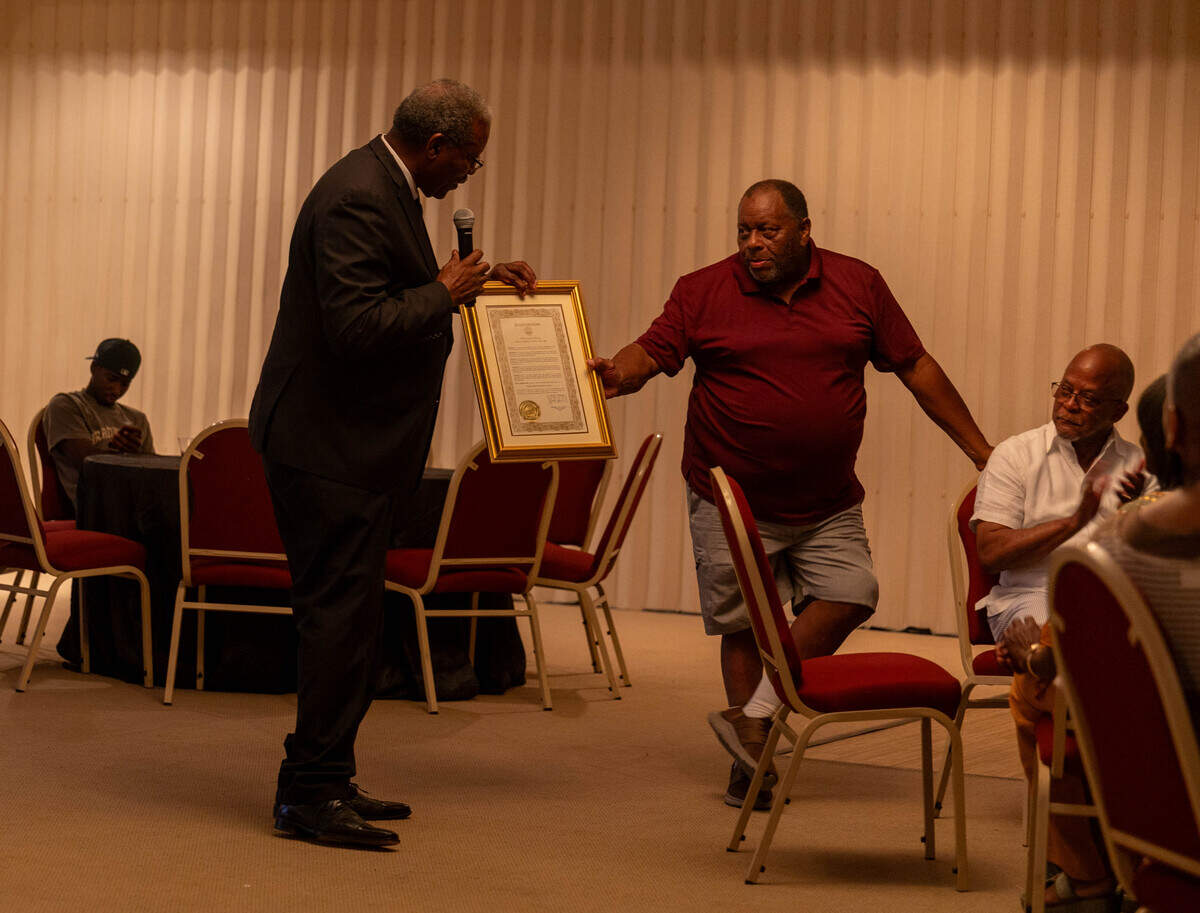 Henri Ficklin, a member of the Bibb County School Board, hands Al Bailey, an original charter member of the Cross-Court Racquet Club, a framed proclamation on Saturday, July 26th. The signed proclamation from Mayor Lester Miller recognizes July 26th, 2025 as “Cross-Court Racquet Club Day” in Macon-Bibb County.