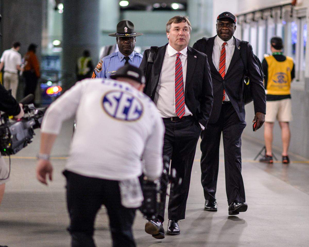Georgia head coach Kirby Smart walks into Mercedes Benz Stadium in Atlanta Saturday prior to the Bulldogs’ SEC Championship game against Alabama.