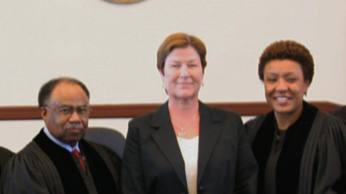 Putnam County Chief Magistrate Judge Ellen Pierce, center, is shown in this 2007 photo with Georgia Supreme Court Justice Robert Benham, left, and Chief Justice Leah Ward Sears after the Supreme Court held a special session in Putnam County. Pierce was killed in a traffic accident Saturday.