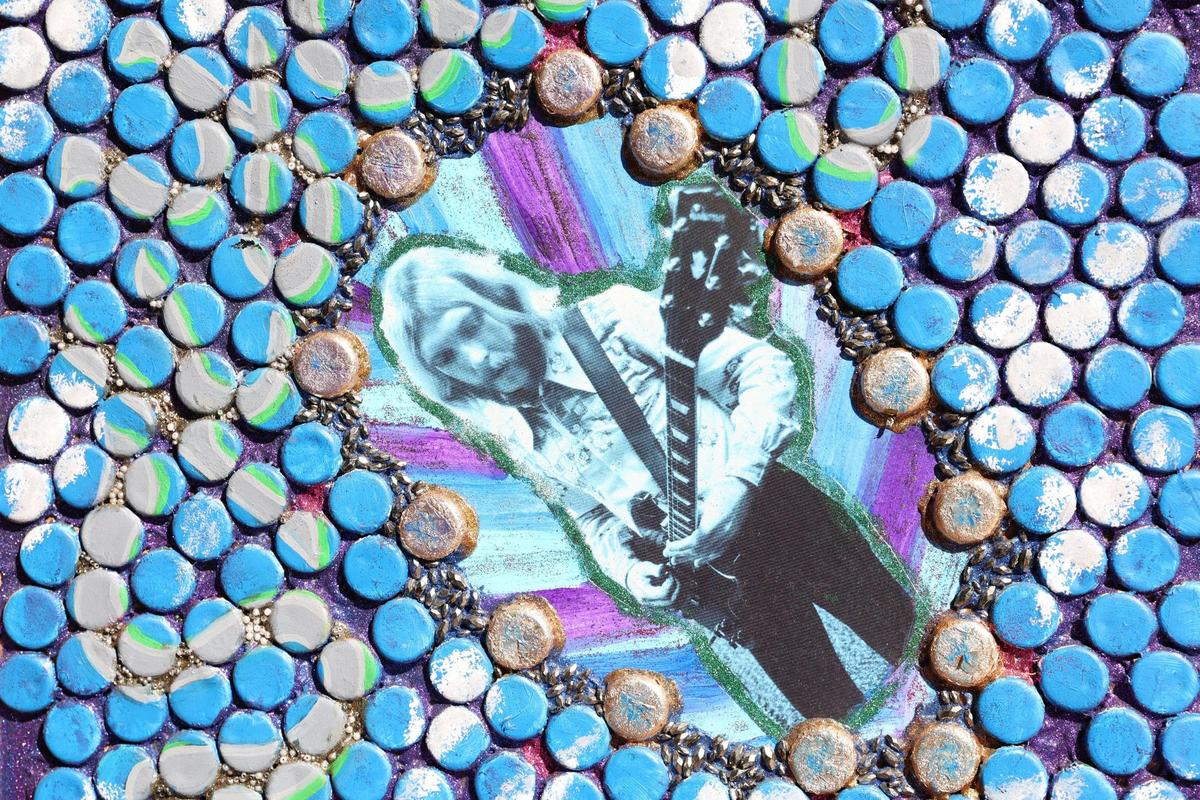 A piece of John Mollica’s artwork, created with painted bottle caps and a photograph of Duane Allman, hangs inside of The Church of Duane Allman on Sunday, Nov. 24, 2024, during Skydog Festival at Carolyn Crayton Park in Macon, Georgia. John Mollica created The Church of Duane Allman art exhibit to showcase his art and share the legacy of guitarist and front man of The Allman Brothers Duane Allman, a key figure in Macon music history.