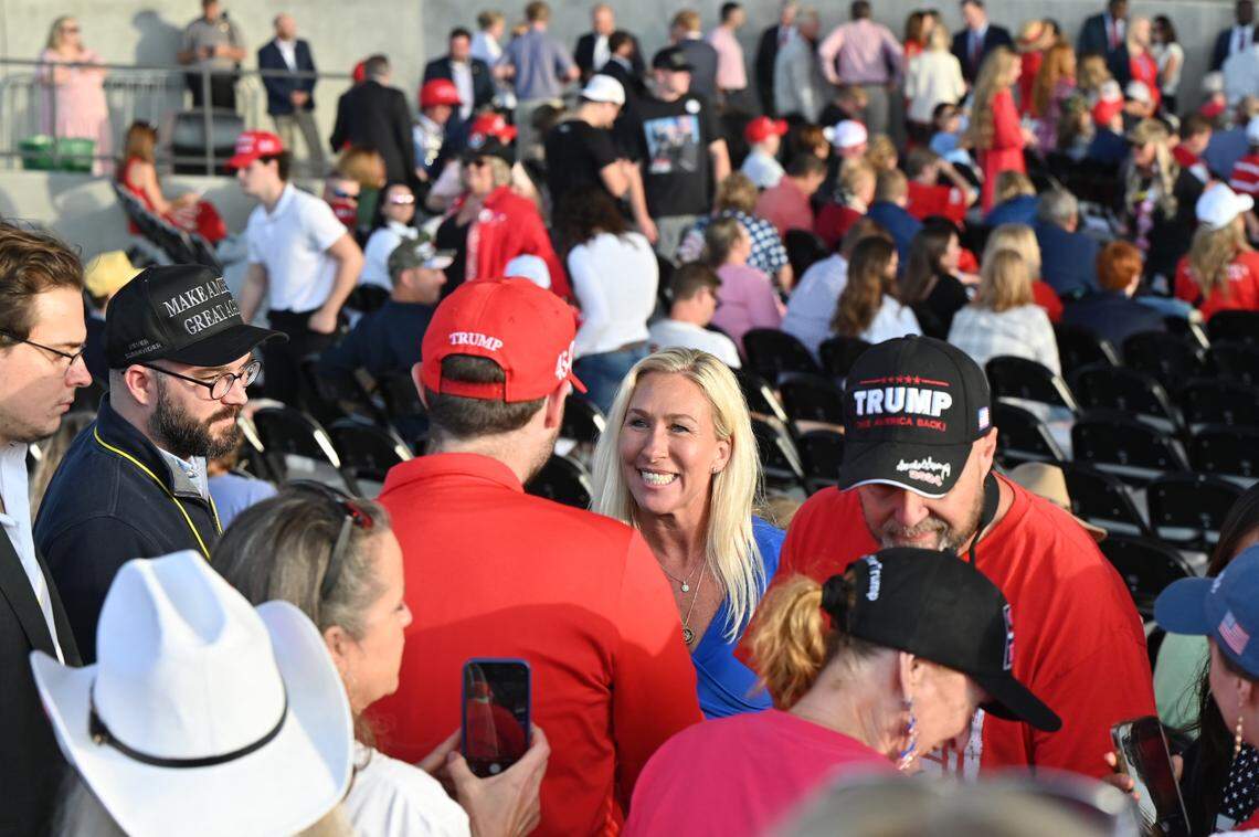 U.S. Georgia House Representative Marjorie Taylor Greene greets attendees before the start of Republican presidential candidate Donald Trump’s “Make America Great Again” Rally on Sunday, Nov. 3, 2024, at Atrium Health Amphitheater in Macon, Georgia.
