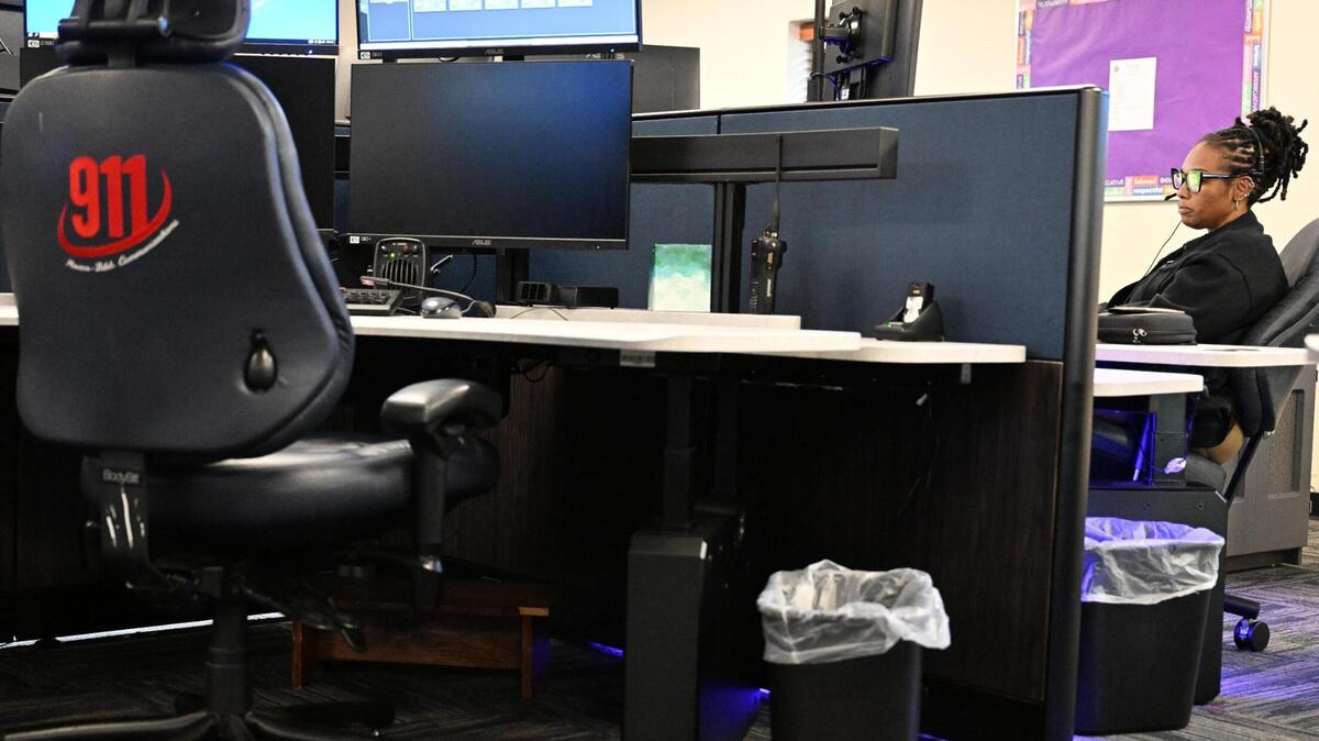 A 911 dispatcher responds to a call on Wednesday, May 7, 2025, at the Macon-Bibb County 911 Communications Center in Macon, Georgia. Dispatchers rank calls based on severity, which prompts how quickly deputies should respond.