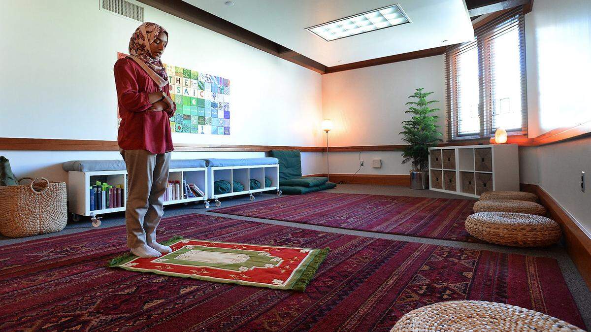 Duke University student Yossra Hamid stands on her prayer rug in the Mosaic, a prayer room in Keohane dorm, on Feb. 18 in Durham, North Carolina. Hamid, a senior, prays five times a day and said she welcomed the university's willingness to accommodate the diverse religious practices of its student body.