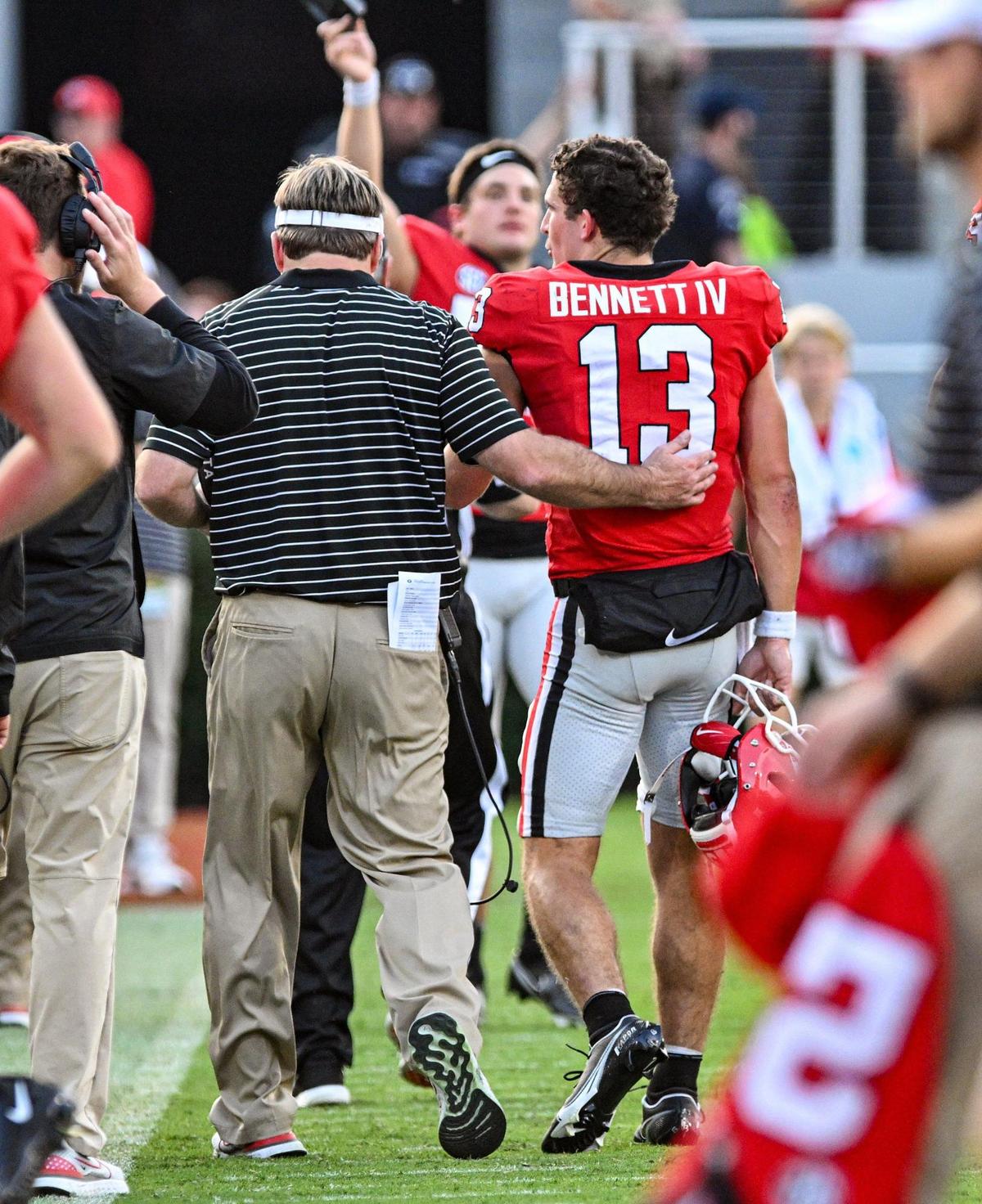 Coach Kirby Smart talks with Georgia quarterback Stetson Bennett late in the 3rd quarter as the beat Vanderbilt 52-0.