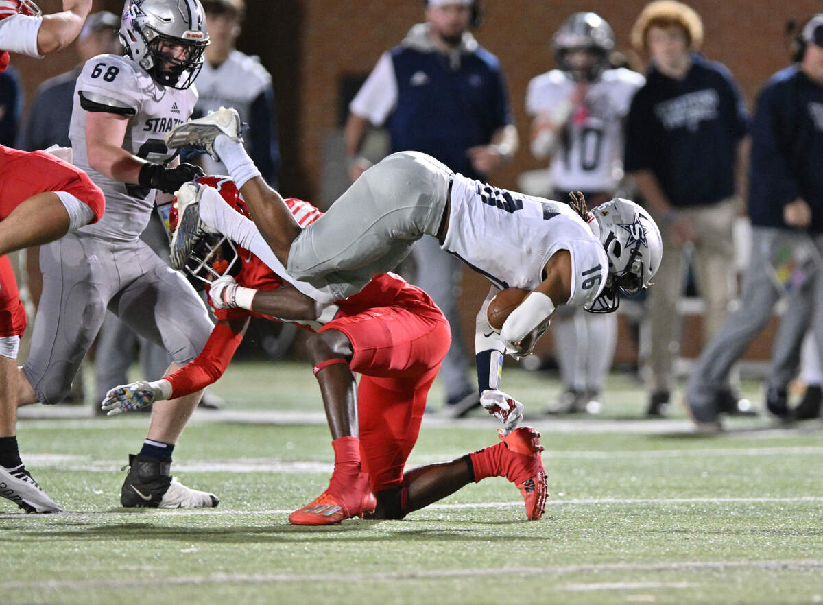 Stratford running back Shaun Wilmore get trips up in the midfield against Saint Anne-Pacelli Friday night.