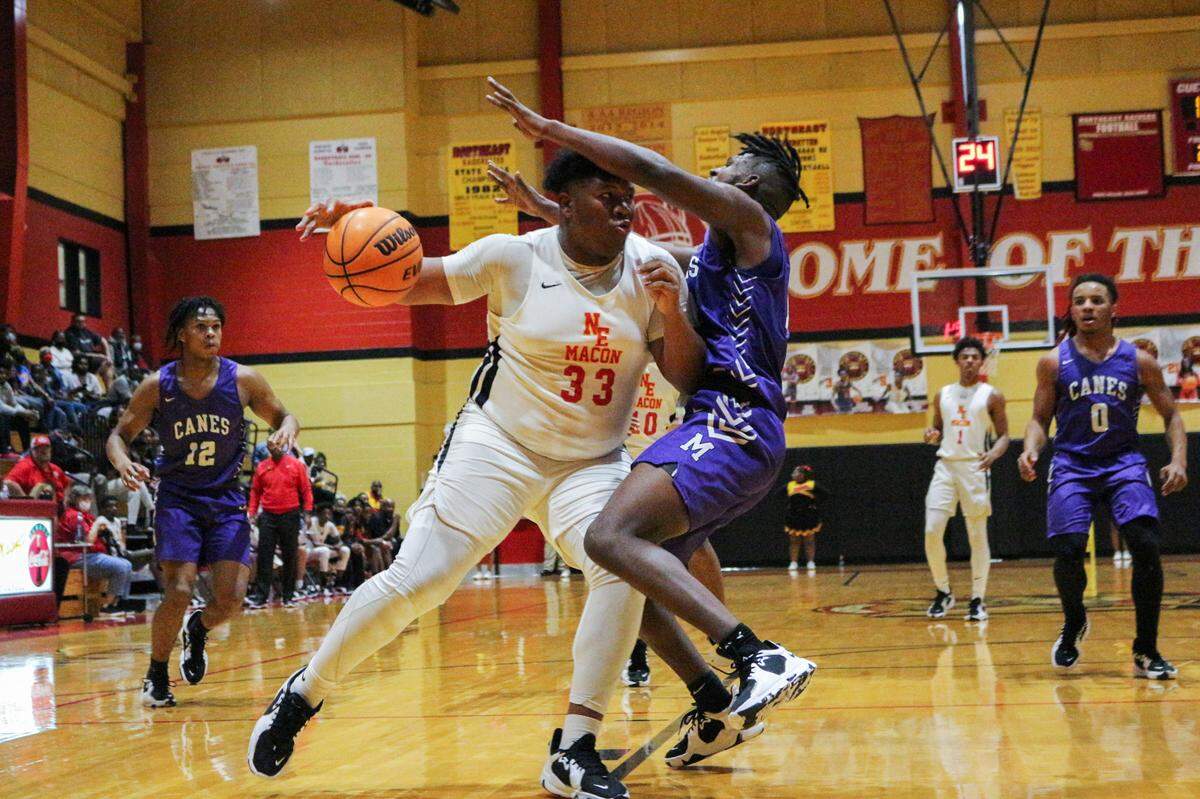 Northeast’ Cadricas Stanley (33) drives on a Jasper county defender during their region playoff game player on February 18, 2022.