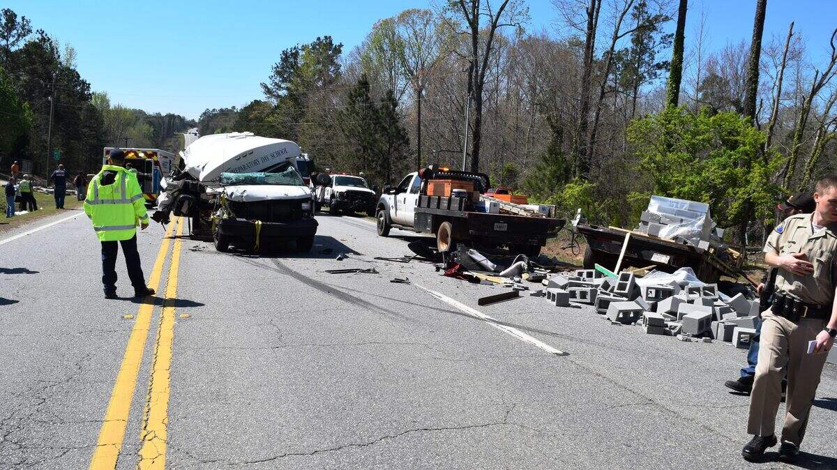 An Augusta Preparatory Day School bus carrying the school's golf team crashed into the back of a stopped flatbed truck pulling a trailer filled with concrete blocks Thursday afternoon on Ga. 49 in Jones County.  A golf coach was seriously injured in the crash.