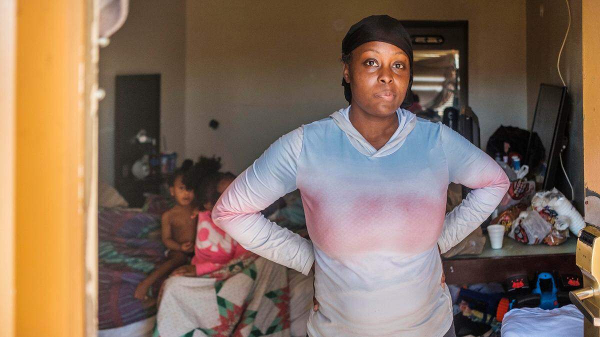 Keisha Gibson at the motel room she shares with her seven children. Gibson’s children meet the definition of homeless twice over under a federal education law. Under federal housing law they do not, locking Gibson and her kids out of housing aid.