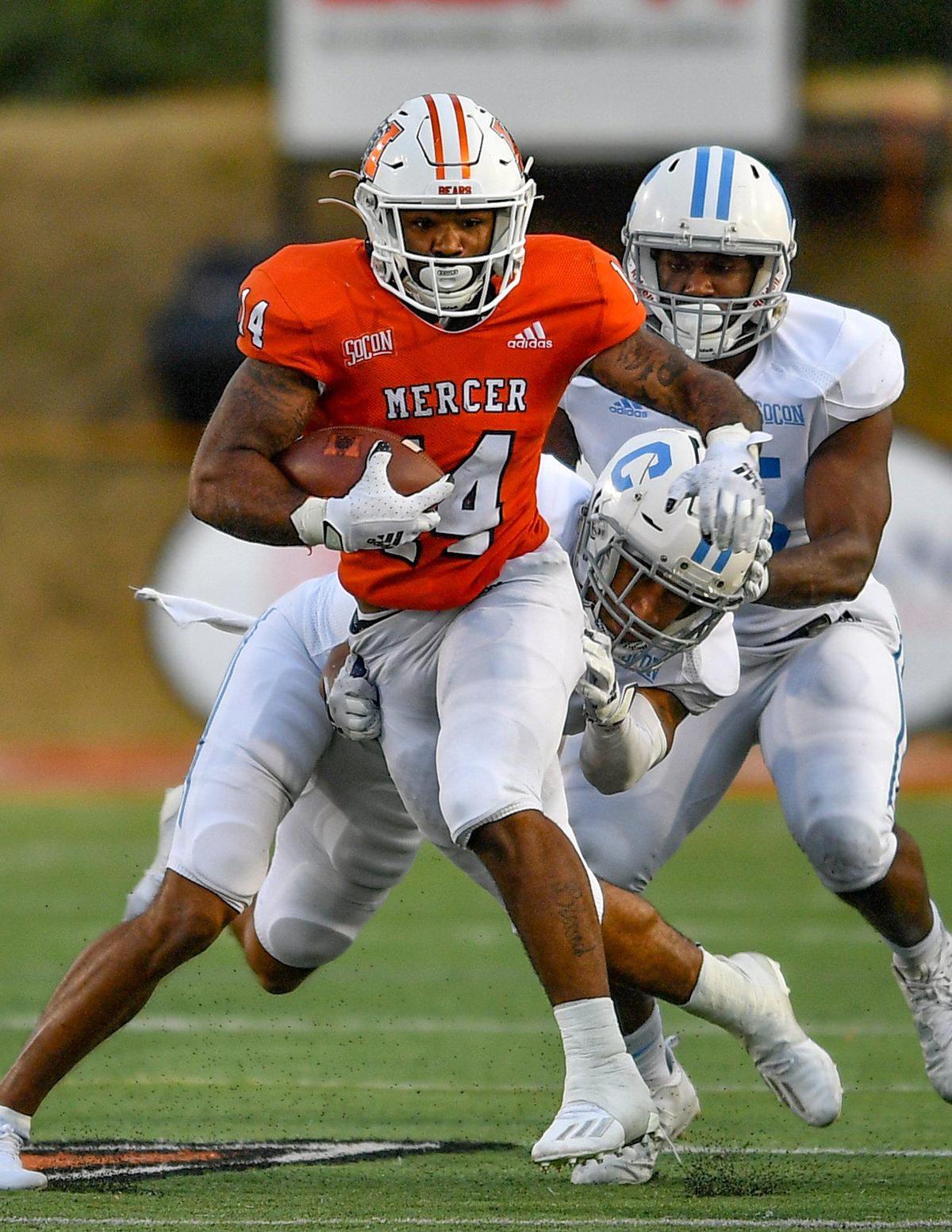 DONN RODENROTH,Macon, Georgia, 02/27/2021: Mercer running back Nakendrick Clark breaks through the Citadel defense for a first down in action Saturday in Macon.