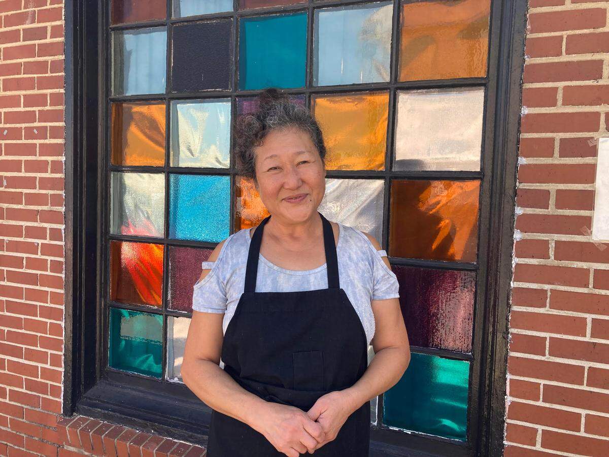 Miyang Rutherford outside her beloved Kimchi Factory restaurant in downtown Macon. The restaurant is closing.