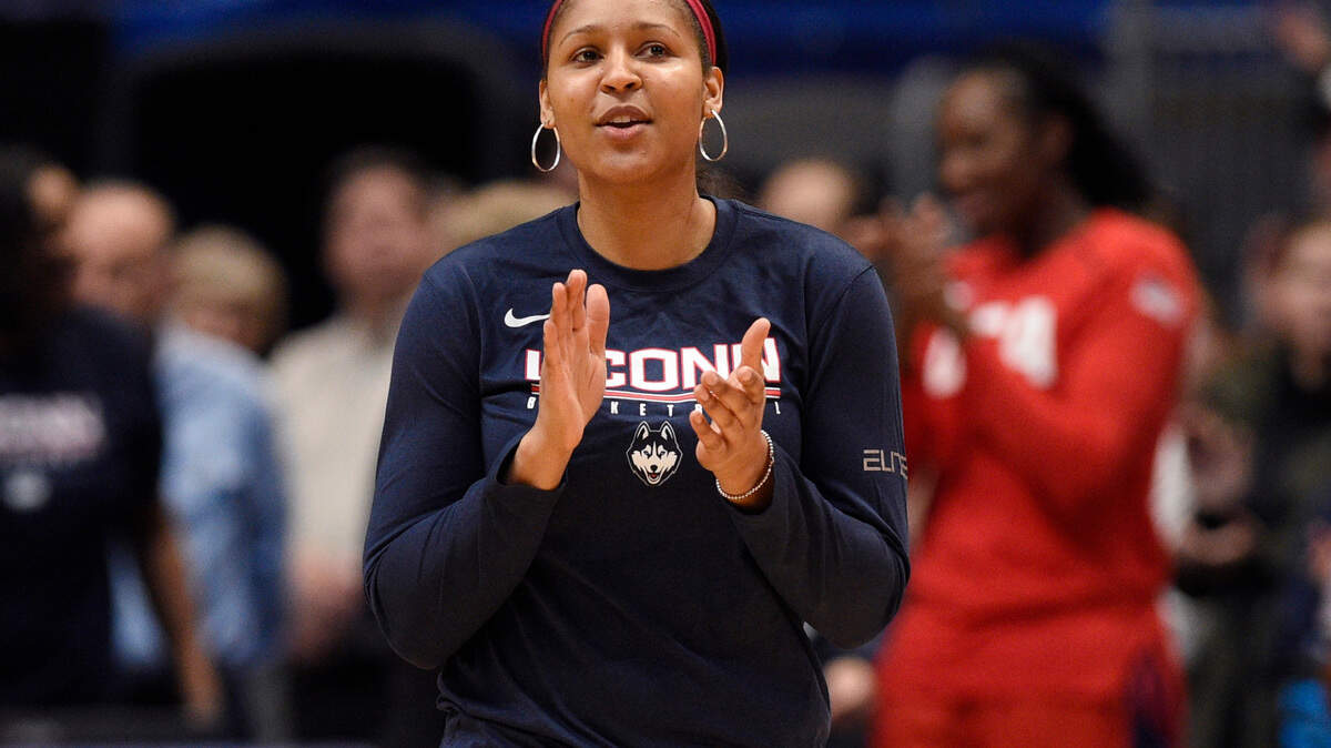 In this file photo, former Connecticut and Minnesota Lynx player Maya Moore applauds in Hartford, Conn. Moore was inducted into the Georgia Sports Hall of Fame Saturday night as part of a class that included Brian Jordan, Tom Glavine, Joe Hamilton, Tony Barnhart, Janet Harris, Matt Stinchcomb and Ray Lamb.