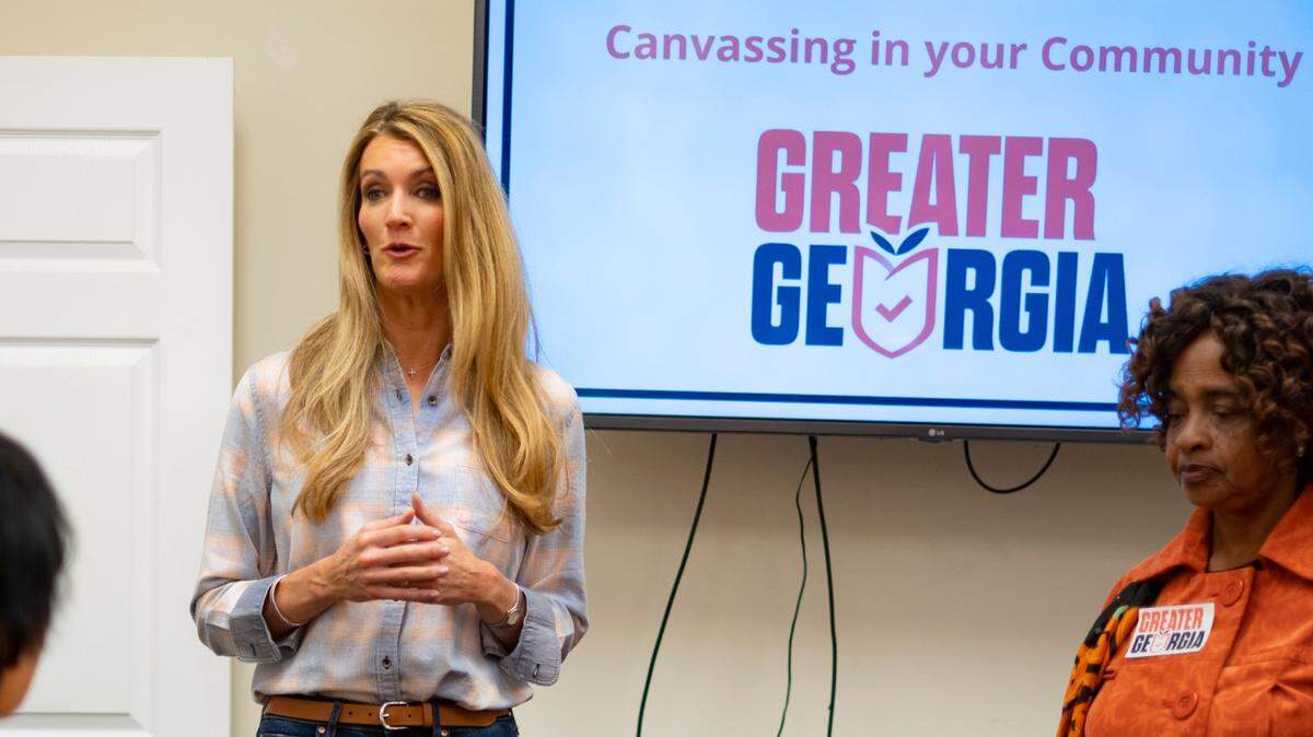 Former Sen. Kelly Loeffler, R-Ga., speaks to volunteers before a Greater Georgia voter registration canvassing effort, Saturday, Oct. 8, 2022, in Marietta, Ga.