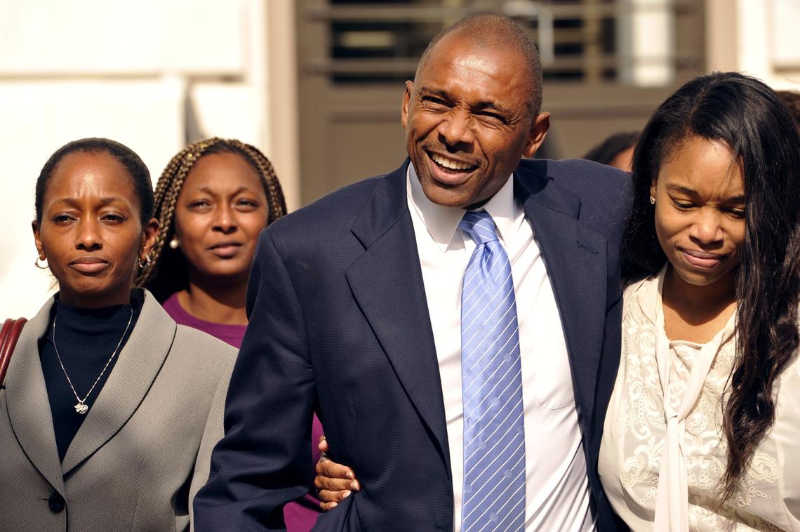 Cliffard D. Whitby, the former executive director of the Macon Promise Neighborhood, middle, leaves the United States District Court on Tuesday surrounded by his family after being found not guilty of federal bribery and money laundering charges.