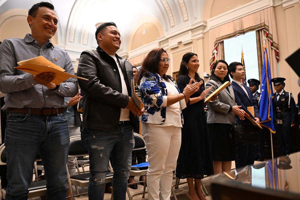 Petitioners applaud after officially becoming United States citizens on Wednesday, April 8, 2026, at the Bootle Federal Courthouse in Macon, Ga. Seventeen petitioners became U.S. citizens in Macon on Wednesday, representing 11 different countries and traveling from across Georgia for the ceremony.