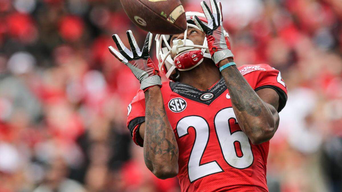 Georgia wide receiver Malcolm Mitchell (26) catches a pass for a touchdown against Penn State during the second half of the TaxSlayer Bowl NCAA college football game, Saturday, Jan. 2, 2016, in Jacksonville, Florida. Georgia won 24-17.