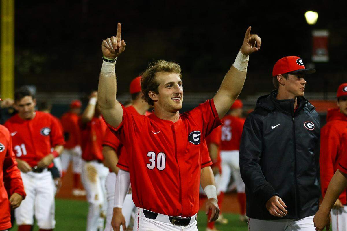 Georgia catcher Mason Meadows (30) thanks the fans after their victory over Clemson.