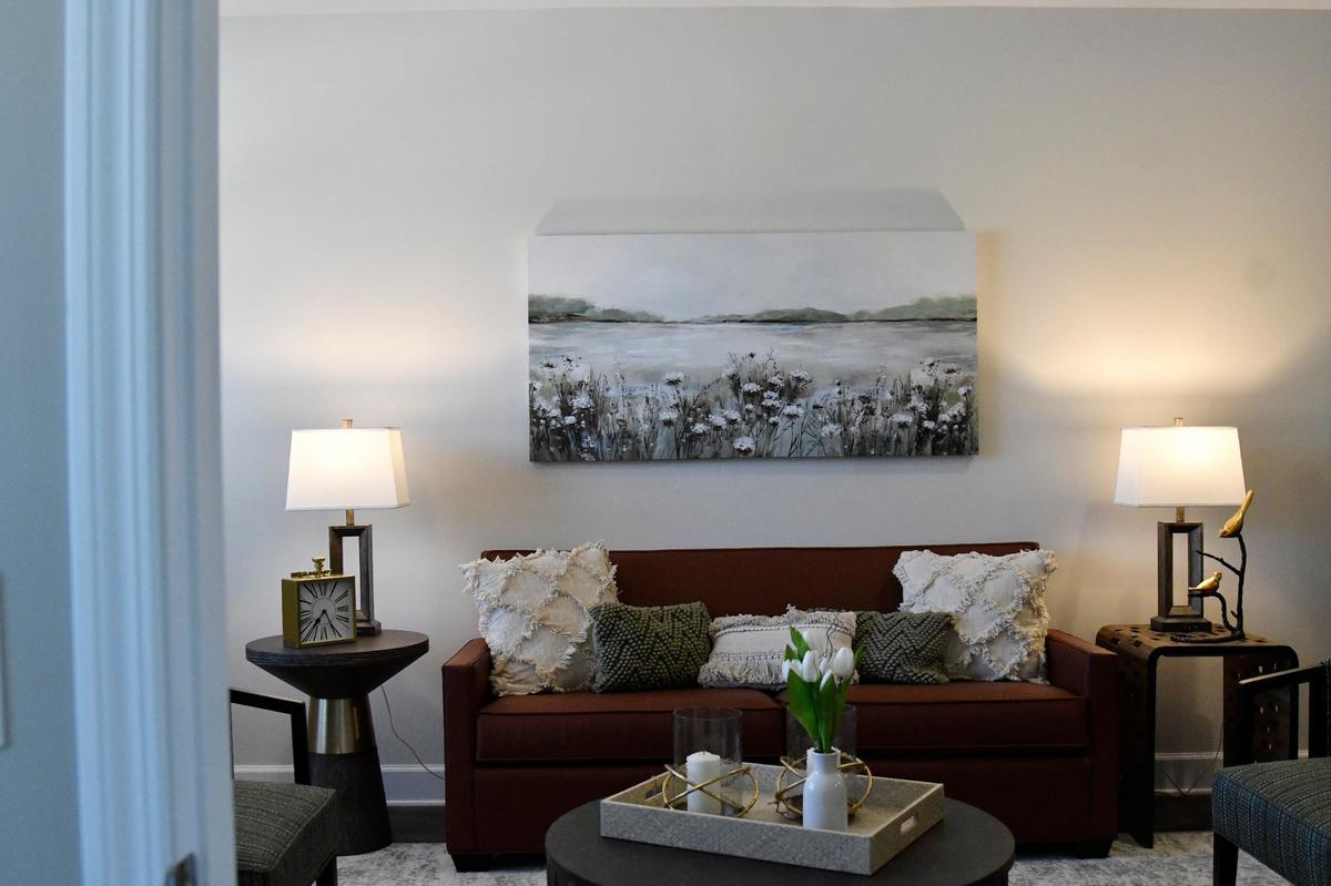 A model living room inside of the new Central City Apartments sits set up for visitors on Monday, May 20, 2024, in Macon, Georgia. The new complex will be comprised of 82 affordable housing units and a 12 bed medical respite and clinic next door.