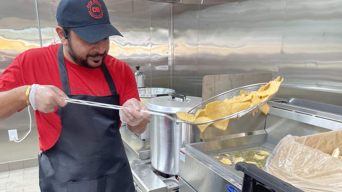 Kelvin Patel deep fries nacho chips at the new DosBros Fresh Mexican Grill in Warner Robins. The chips are fried in non-GMO sunflower oil and then sprinkled with kosher salt and lime juice.