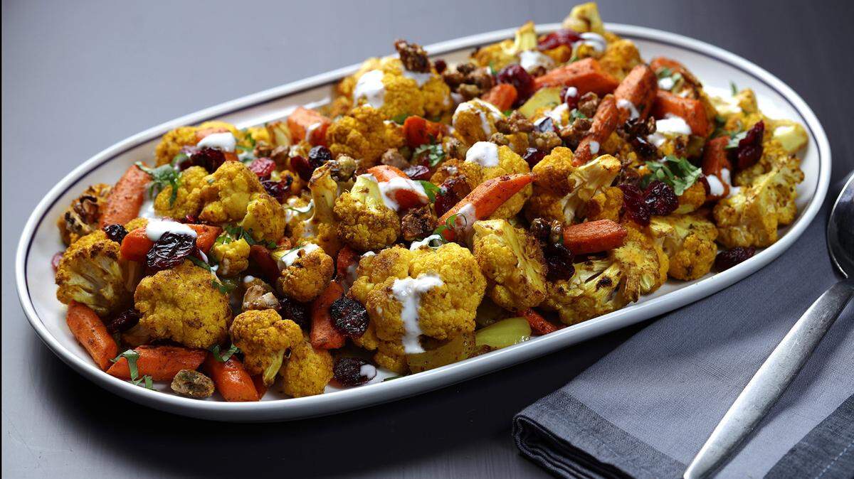 Caulifower, carrots and onions come off the grill with a hint of wood smoke. A drizzle of yogurt and a sprinkling of herbs finishes the dish.