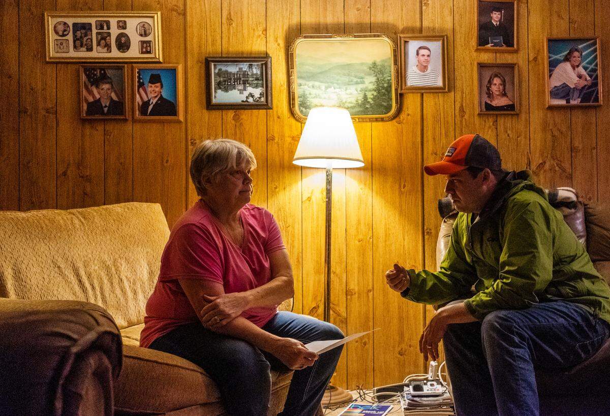 Gloria Hammond, left, of Juliette, listens as Fletcher Sams of the Altamaha Riverkeeper tells her that the preliminary results of tests of her well water show it is many times over the California limit for the toxin hexavalent chromium.