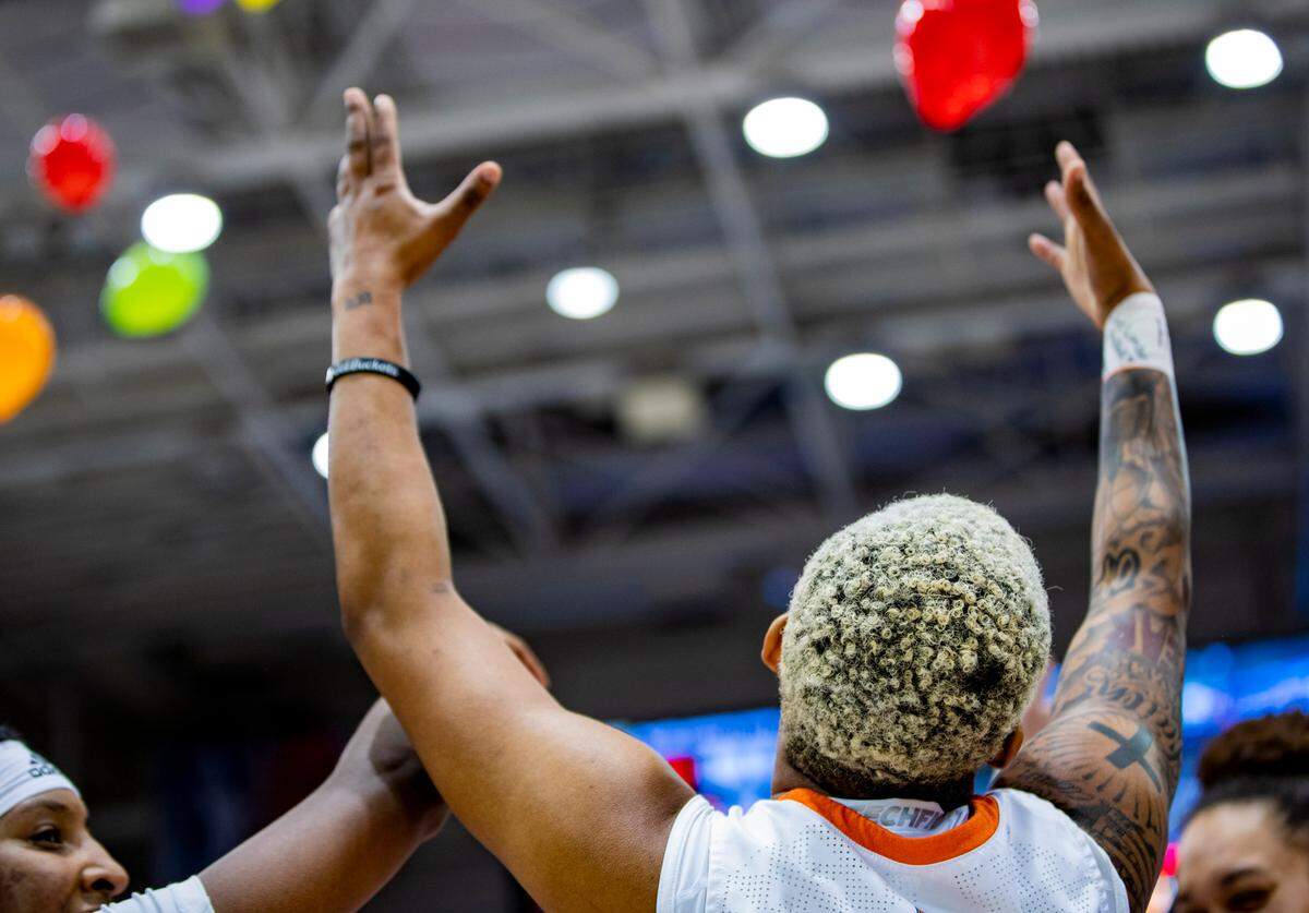 The Mercer women’s basketball team celebrates after defeating Furman 73-54 in the SoCon Ingles Basketball Championship Saturday afternoon at the Harrah’s Cherokee Center in Asheville, N.C.