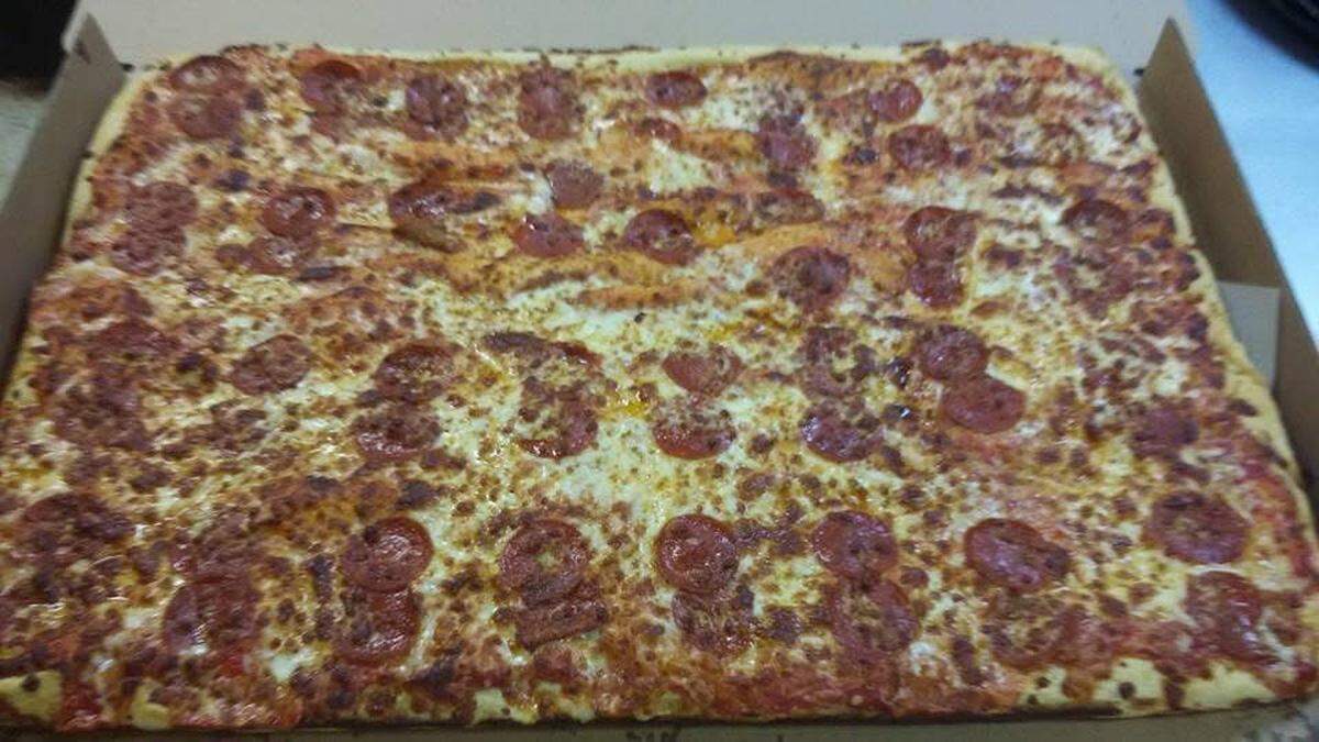 A sheet pizza with pepperoni and extra cheese cheese at My Father’s Place in Warner Robins.