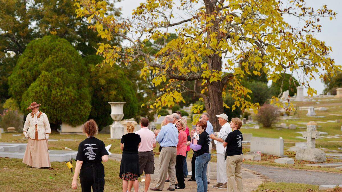 GRANT BLANKENSHIP/isitors take the Spirits in October tour at Riverside Cemetery in Macon in 2013.