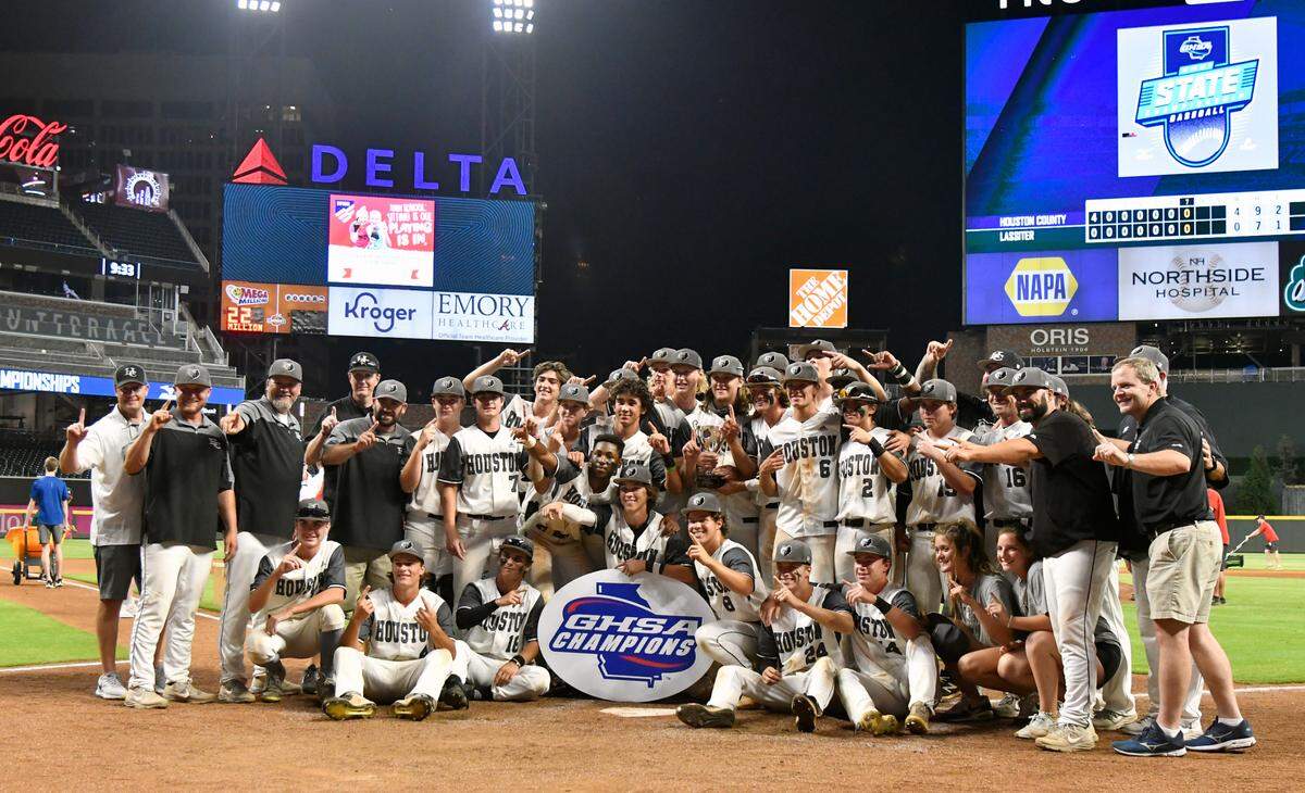Houston County players and coaches pose for a photo after celebrating their GHSA 6A Championship series win over Lassiter Wednesday in Atlanta.