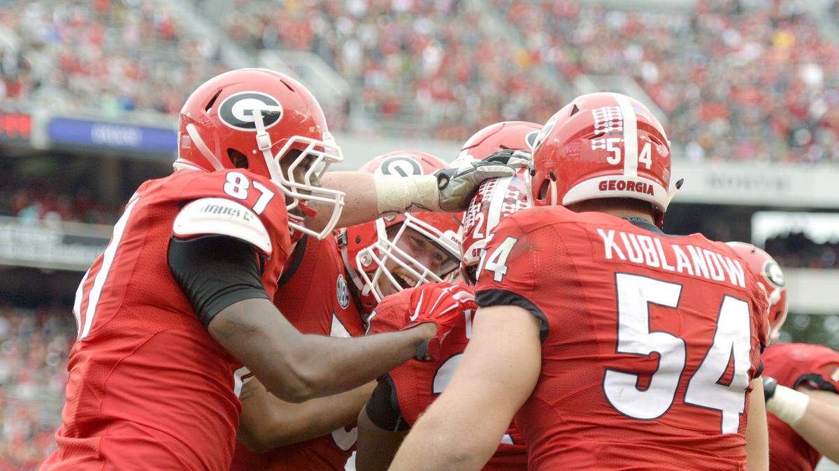 Georgia running back Nick Chubb (27) gets congratulated by teammates after a third quarter touchdown during their game against Southern Saturday.