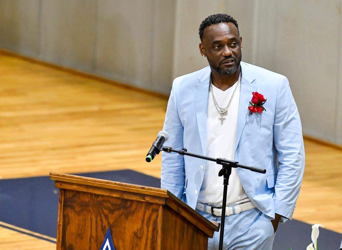 Derex Butts speaks at the funeral of his son Devin Butts Saturday inside the Stratford Academy gym to celebrate the life of former basketball player, who died May 5.