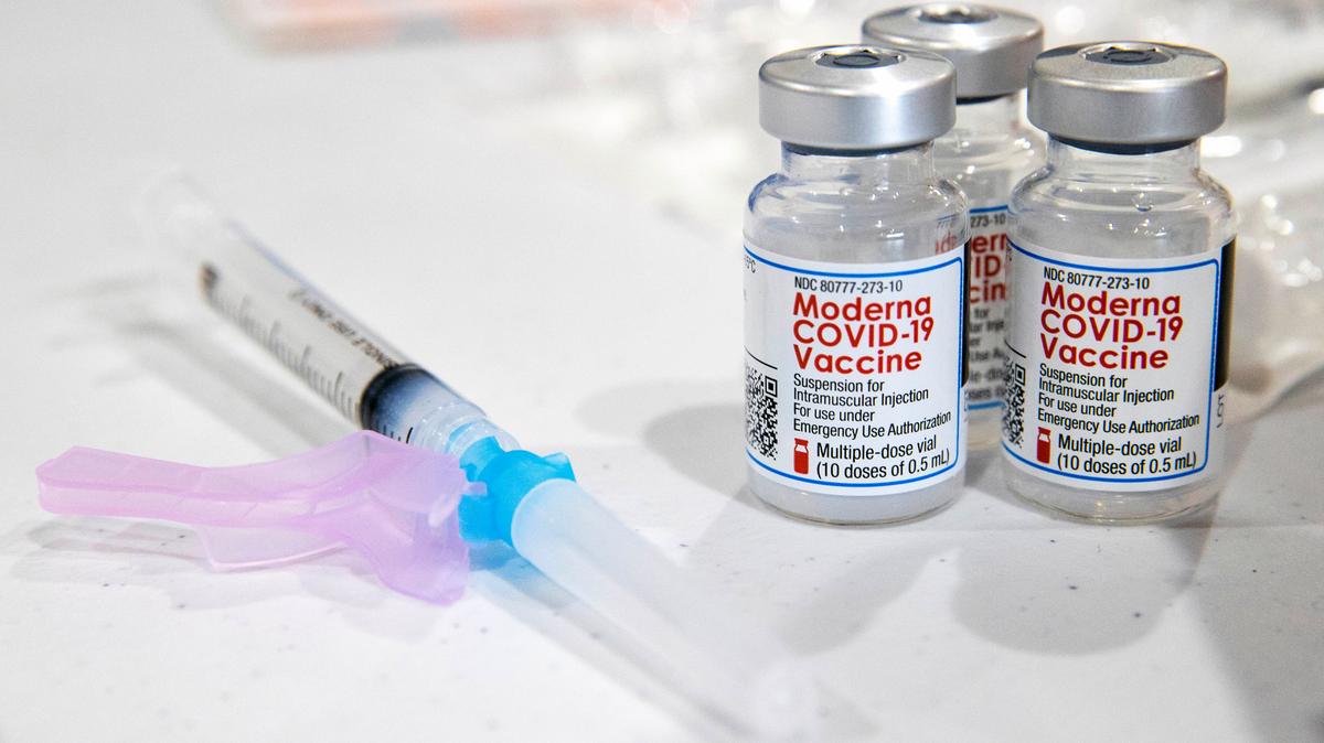In this Jan. 9, 2021, file photo, vials of the Moderna COVID-19 vaccine are placed next to a loaded syringe in Throop, Pa.
