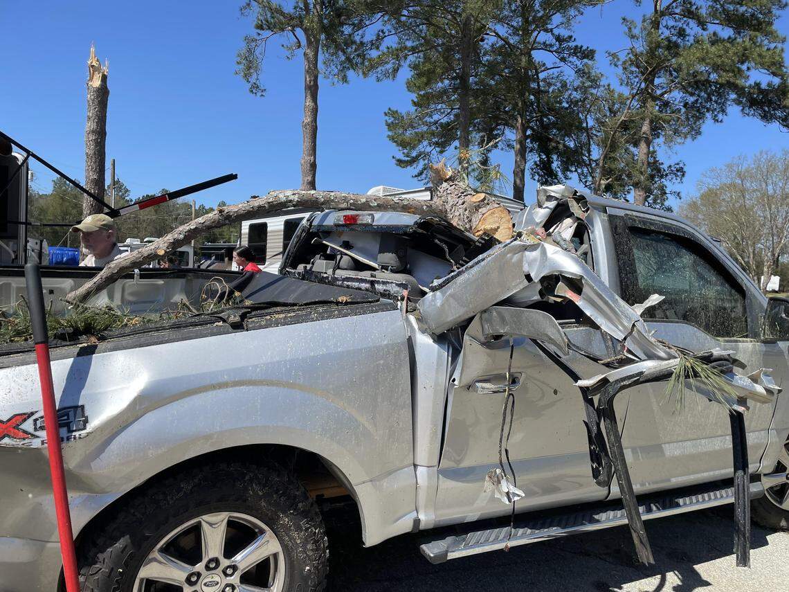 A downed tree during a severe thunderstorm that spawned a tornado destroyed a pickup truck early Thursday, March 12, 2026, at the Ponderosa RV Park in Peach County. 
