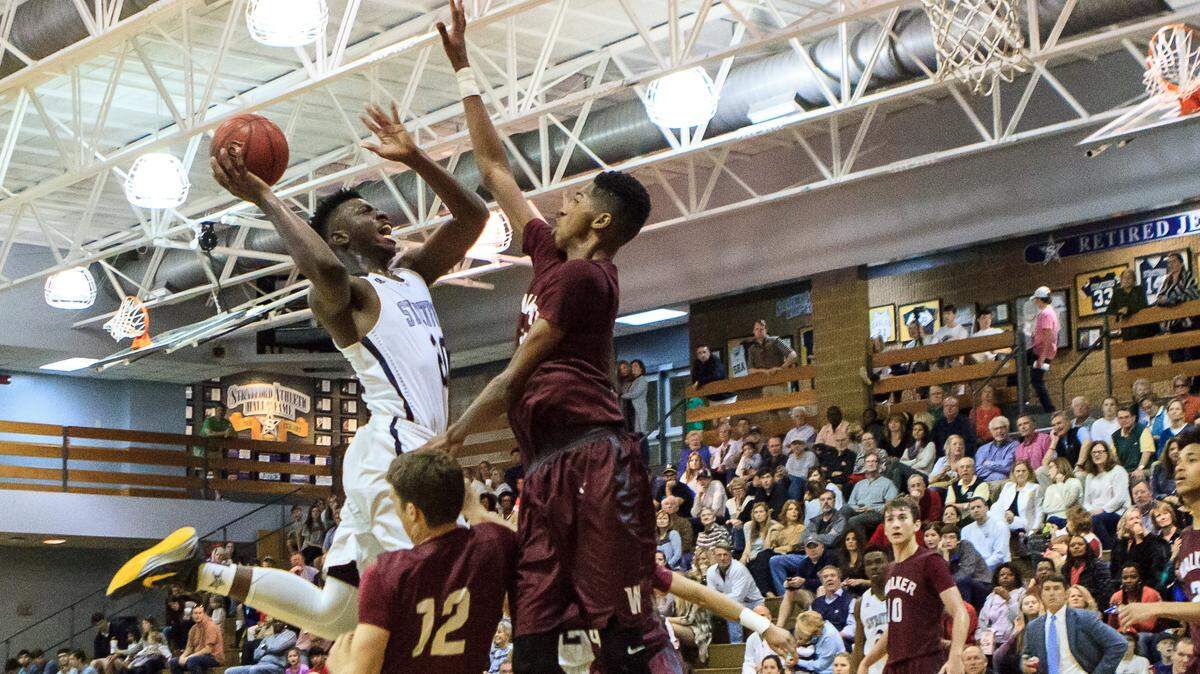 Stratford's Nate Brooks (20) drives into the lane against Walker during Saturday's GHSA Class A Private Tournament first-round game.