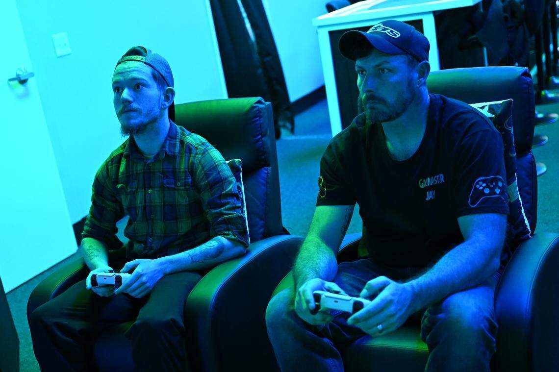 Grayson Hayes (left) plays Call of Duty with Adam Edwards, co-owner of Disconnect Gaming Lounge opening soon in Warner Robins. Edwards, who is retired U.S. Army, said that Call of Duty is the only game he plays.