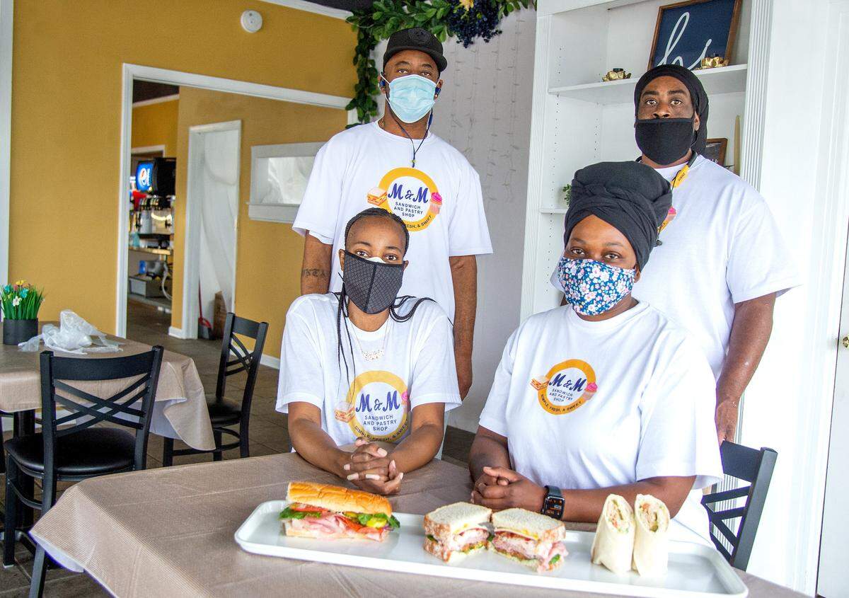 M&M Sandwich and Pastry Shop co-owner Felicia George and her husband Marcel, left and co-owner Monique Moye and her husband Marquis Bell at the restaurant located at 3045 Vineville Ave. in Macon.