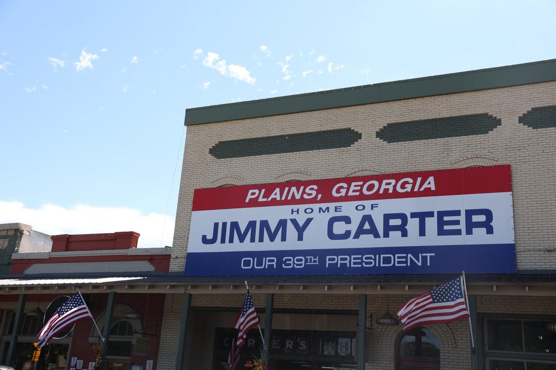 A sign advertising Plains as former president Jimmy Carter’s hometown sits on Tuesday, Oct. 1, 2024, in downtown Plains, Georgia. Former president Carter turned 100 years old on Tuesday, making him the oldest living president in history.