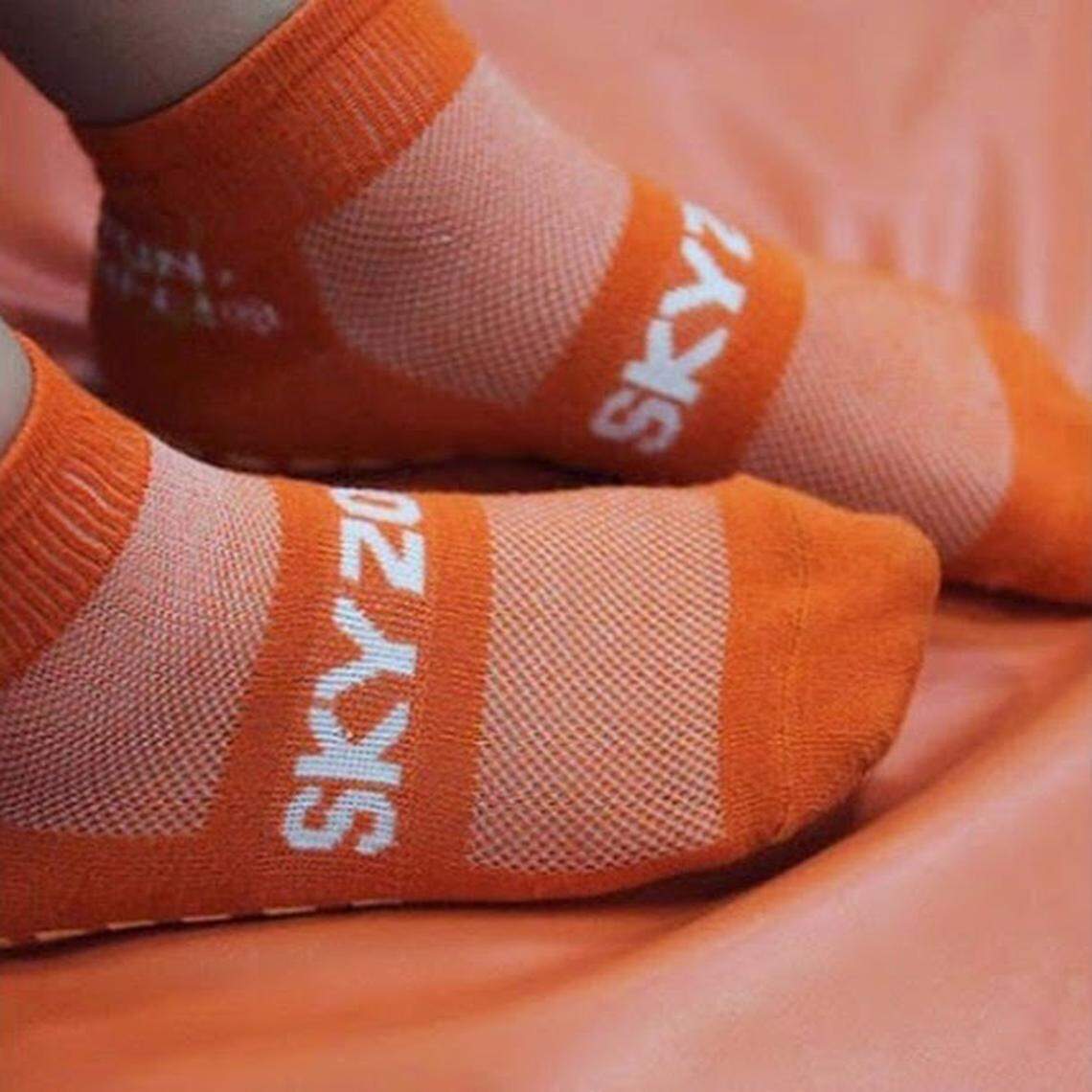 Sky Zone locations require jumpers to wear their patented “SkySocks” with their trademark grip on the bottom.