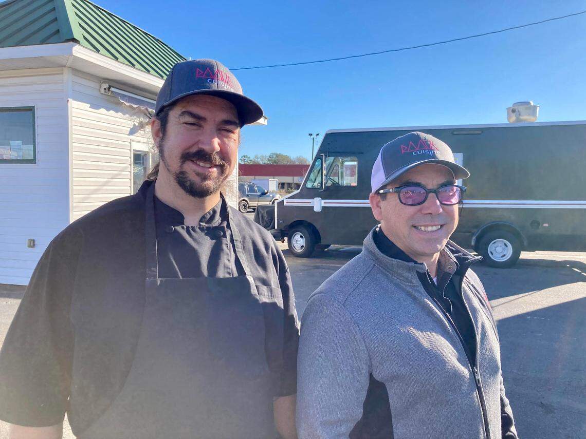 Chefs Scott Kiernan and Jason Delasota outside their new food establishment in Warner Robins. Root 76 Cuisine offers a drive-thru commissary serving breakfast, a food truck serving up international street food for lunch on site and on the go as well as catering services.