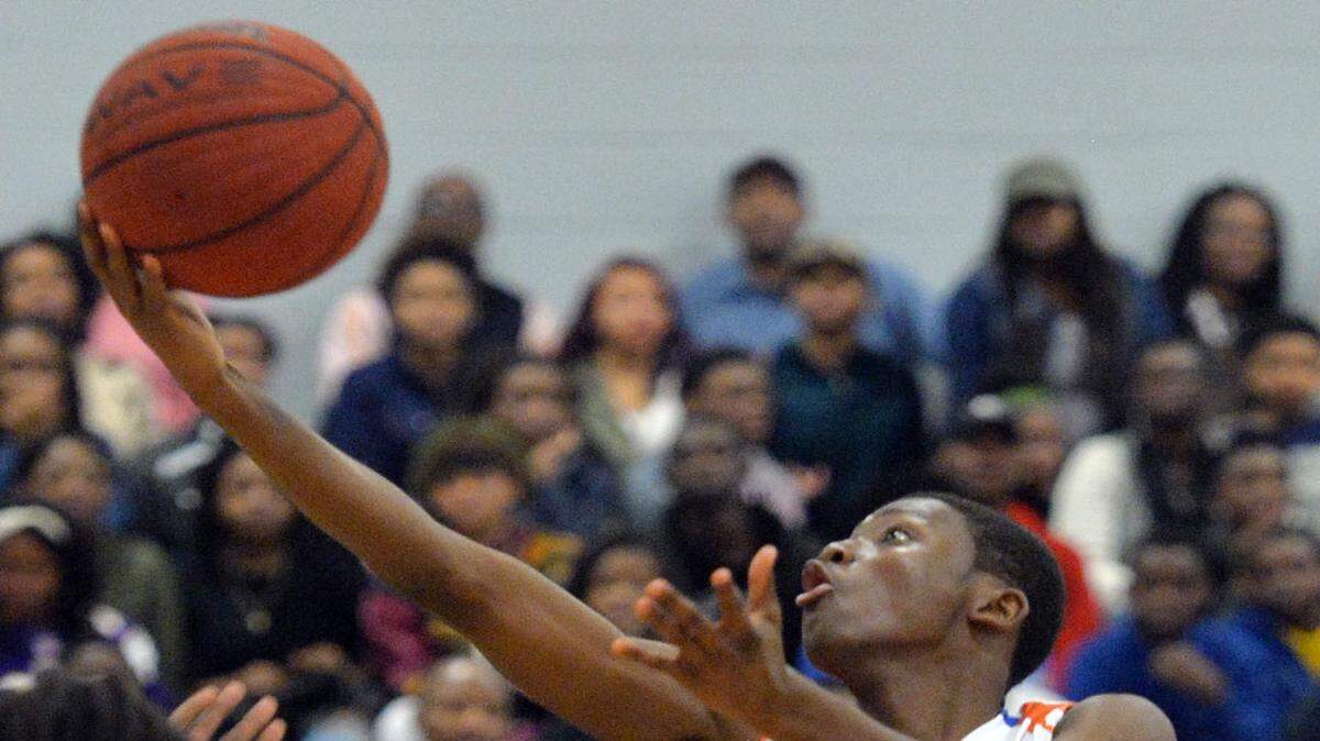 BEAU CABELL/THE TELEGRAPH 
 Macon, Ga., 02/12/2016: Tyrice Paul (4) moves through the lane with his shot after making a steal in the first half.