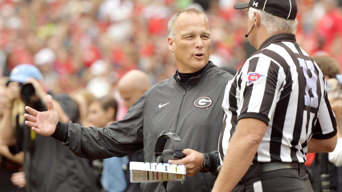 Georgia head coach Mark Richt talks with an official during a timeout of their game Saturday against Southern.