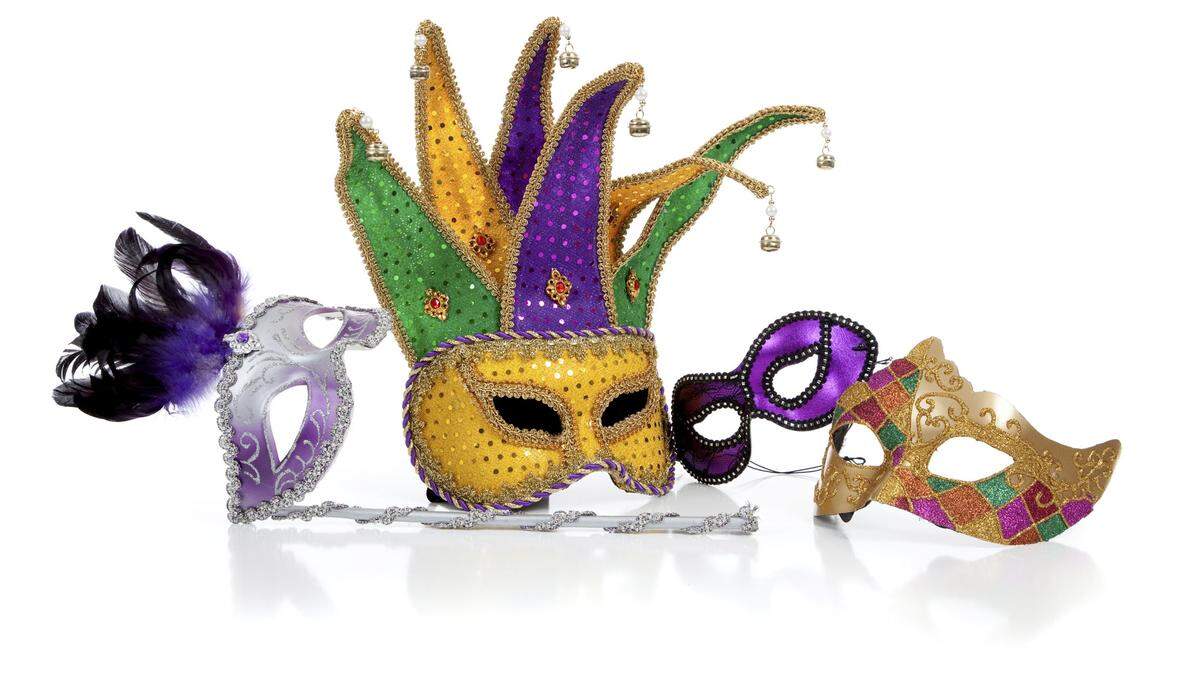 Assorted mardi gra masks on white